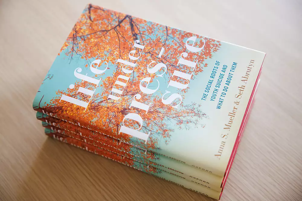 Stack of hardcover copies of Life Under Pressure